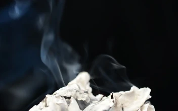 Stock Video Burning Paper On A Black Background For PC