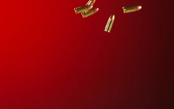 Stock Video Bullets Falling And Bouncing In A Red Background For PC