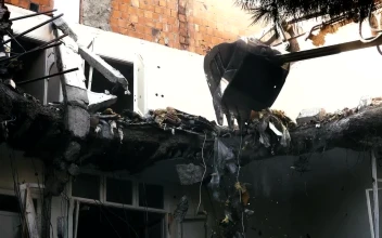 Stock Video Bulldozer Knocking Down A Ruined Building For PC
