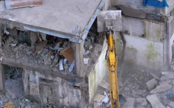 Stock Video Bulldozer Destroying A Concrete Building For PC
