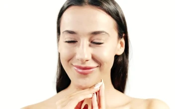 Stock Video Brunette Skincare Model Smiles On White Background For PC