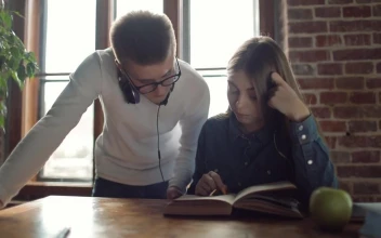 Stock Video Brother Helps Sister With School Studies For PC