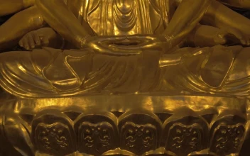 Stock Video Bronze Buddhist Statue In A Temple For PC