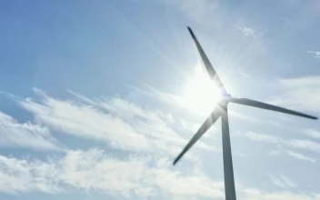Stock Video Bright Sunshine Behind A Wind Turbine For PC