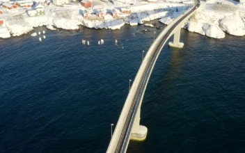 Stock Video Bridge Crossing The Sea Into Snowy Village For PC