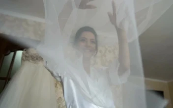 Stock Video Bride Tosses Veil While Dressing For Wedding For PC