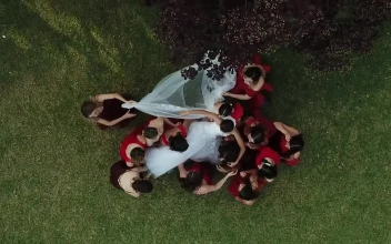 Stock Video Bride At Her Wedding Raised By The Bridesmaids For PC