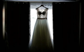 Stock Video Bride Admires Wedding Dress Hanging In Window For PC