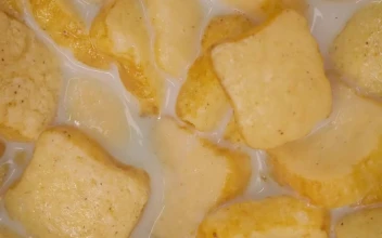 Stock Video Bread Shaped Cereal Texture In Bowl With Milk For PC