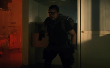 Stock Video Brave Armed Mercenary In An Abandoned Hospital For PC
