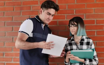Stock Video Boys Man And Woman In A School Reviewing Information For PC