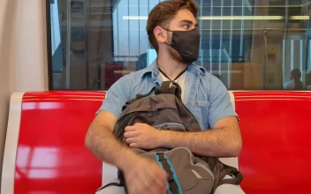 Stock Video Boy With Mask And Backpack Traveling By Subway For PC
