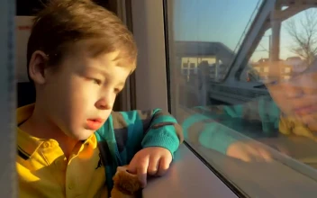 Stock Video Boy Travelling On A Train Through Russia For PC