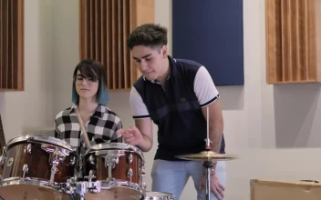 Stock Video Boy Teaching A Girl To Play Drums For PC