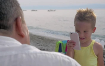 Stock Video Boy Taking A Photo On A Phone For PC