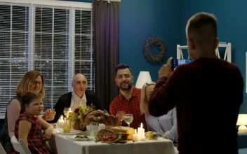 Stock Video Boy Takes A Photo Of Family In Thanksgiving Dinner For PC