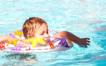 Stock Video Boy Swimming With A Plastic Ring For PC