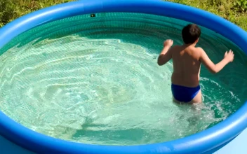 Stock Video Boy Splashing In A Small Pool For PC