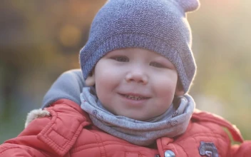 Stock Video Boy Smiling At The Camera On A Cold Day For PC