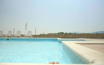 Stock Video Boy Rises Out Of Water In Swimming Pool And Smiles For PC