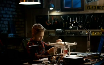 Stock Video Boy Repairing A Drone In The Garage For PC