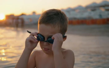 Stock Video Boy Putting On Swimming Goggles For PC