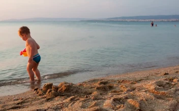 Stock Video Boy Playing At The Seashore For PC