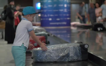 Stock Video Boy Looking For His Bag At An Airport For PC