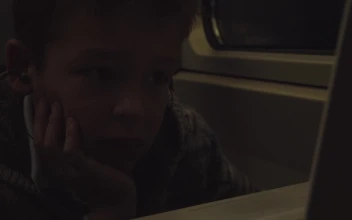 Stock Video Boy Listening To Music On A Train For PC