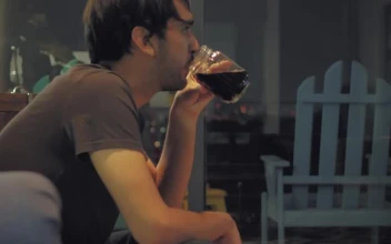 Stock Video Boy Eating On A Sofa While Watching Tv For PC