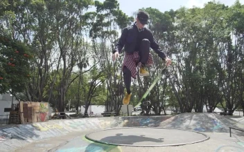 Stock Video Boy Doing A Pirouette With A Skateboard In A Park For PC