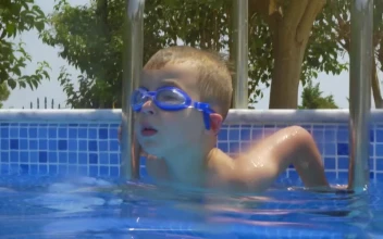 Stock Video Boy Climbing Into A Pool For PC