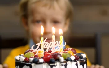 Stock Video Boy Blowing Out Candles On A Cake For PC
