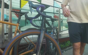 Stock Video Boy And Girl Taking Their Parked Bicycles For PC