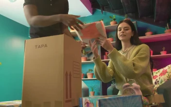 Stock Video Boy And Girl Packing Things In A Box For PC