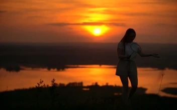 Stock Video Boy And Girl Playing Badminton In The Sunset For PC