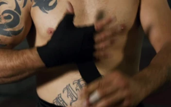Stock Video Boxer Wrapping Their Hands In Black Fabric For PC