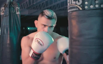 Stock Video Boxer Training With A Punching Bag At The Gym For PC