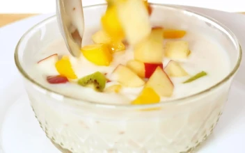 Stock Video Bowl With Yogurt Served With Chopped Fruit For PC