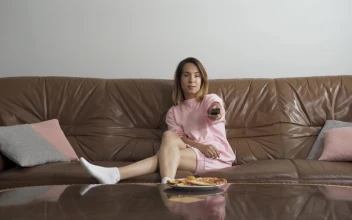 Stock Video Bored Woman Flips Tv Channels On Sofa With Remote For PC
