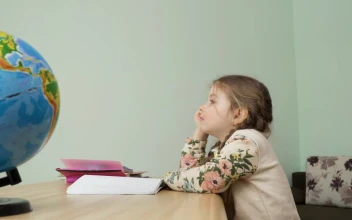 Stock Video Bored Little Girl Puts Head Down On Table For PC