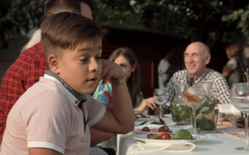 Stock Video Bored Boy On A Family Dinner For PC