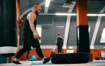 Stock Video Bodybuilder Flips A Tire On The Gym Floor For PC