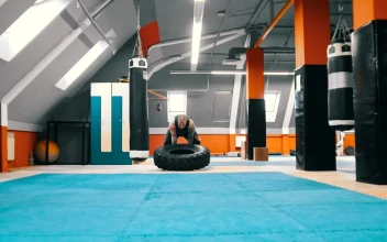 Stock Video Bodybuilder Flips A Tire On The Floor Over And Over For PC