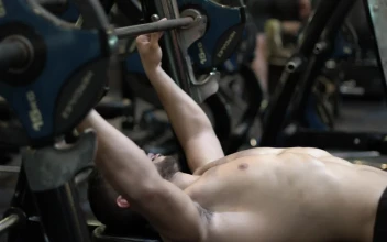 Stock Video Bodybuilder Doing Chest Exercises In The Gym For PC
