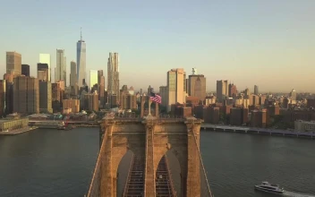 Stock Video Boat On The River Crossing The Brooklyn Bridge For PC