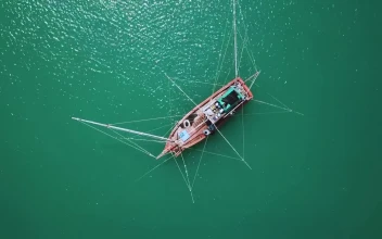 Stock Video Boat In The Middle Of The Sea Seen From Top For PC