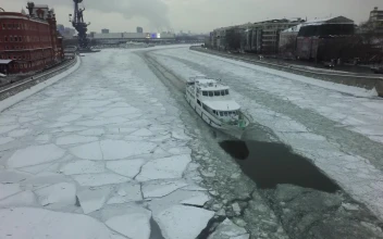 Stock Video Boat Heading Down A Frozen River For PC