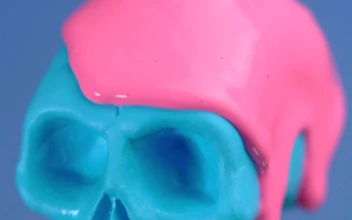 Stock Video Blue Plastic Skull Covered With A Pink Liquid On A For PC