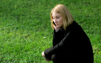 Stock Video Blonde Woman Using Her Phone Outside For PC